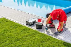 pool-specialist-installing-the-composite-deck-resize-1.jpg